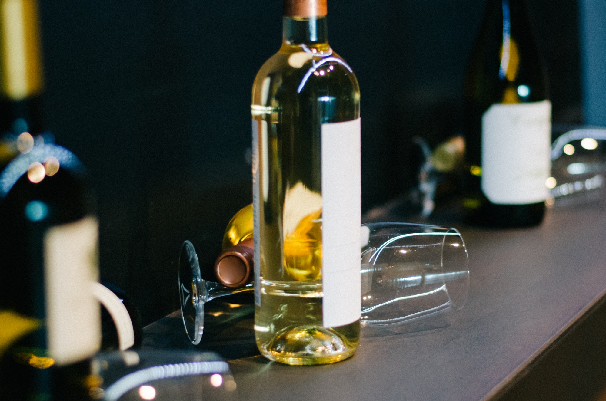 Wine bottles and empty wine glasses